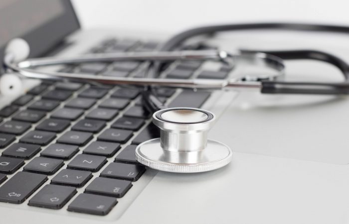 Stethoscope laying on a laptop keyboard