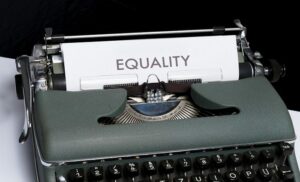 Old fashioned type writer that says equality