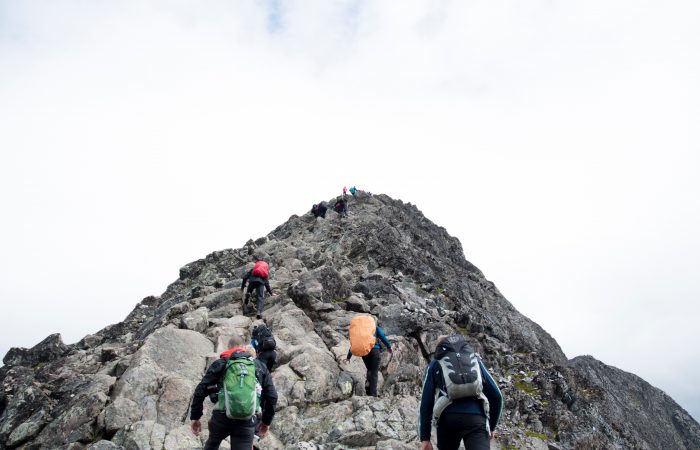 People summitting a mountain