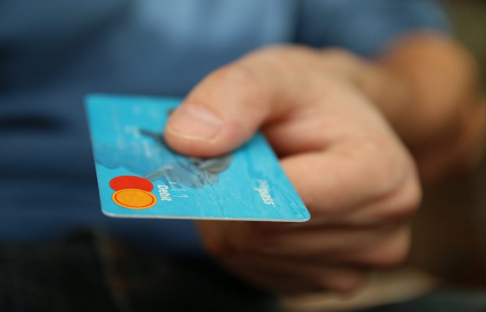 Person holding credit card