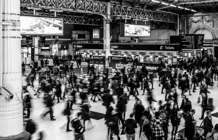 busy blur of people in a train station