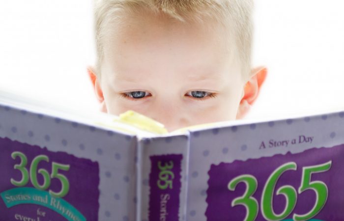 child reading English book