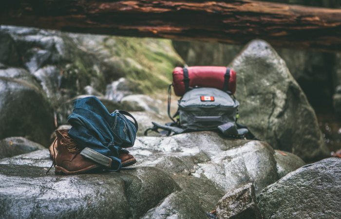 backpacks on a wet rock