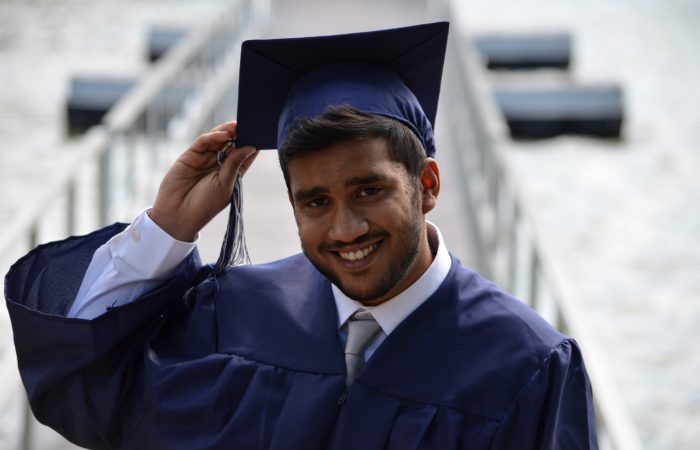 Graduate in navy blue