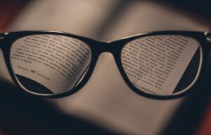 through glasses lenses text from a book in focus