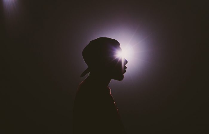 Person standing in a spotlight